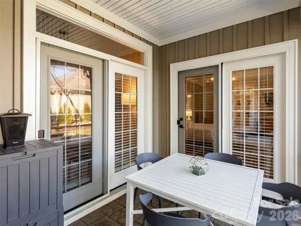 a view of a deck with table and chairs