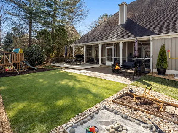 a view of a house with swimming pool and sitting area