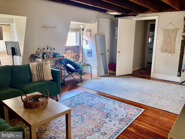 a living room with furniture and a rug