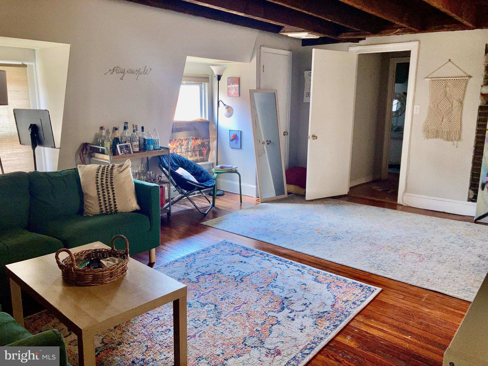 928-930 Pine Street, Unit 4R Philadelphia, PA 19107 - Photo 3 of 15 a living room with furniture and a rug