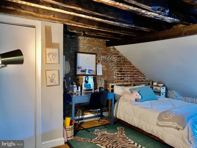 a bed room with a bed and a book shelf