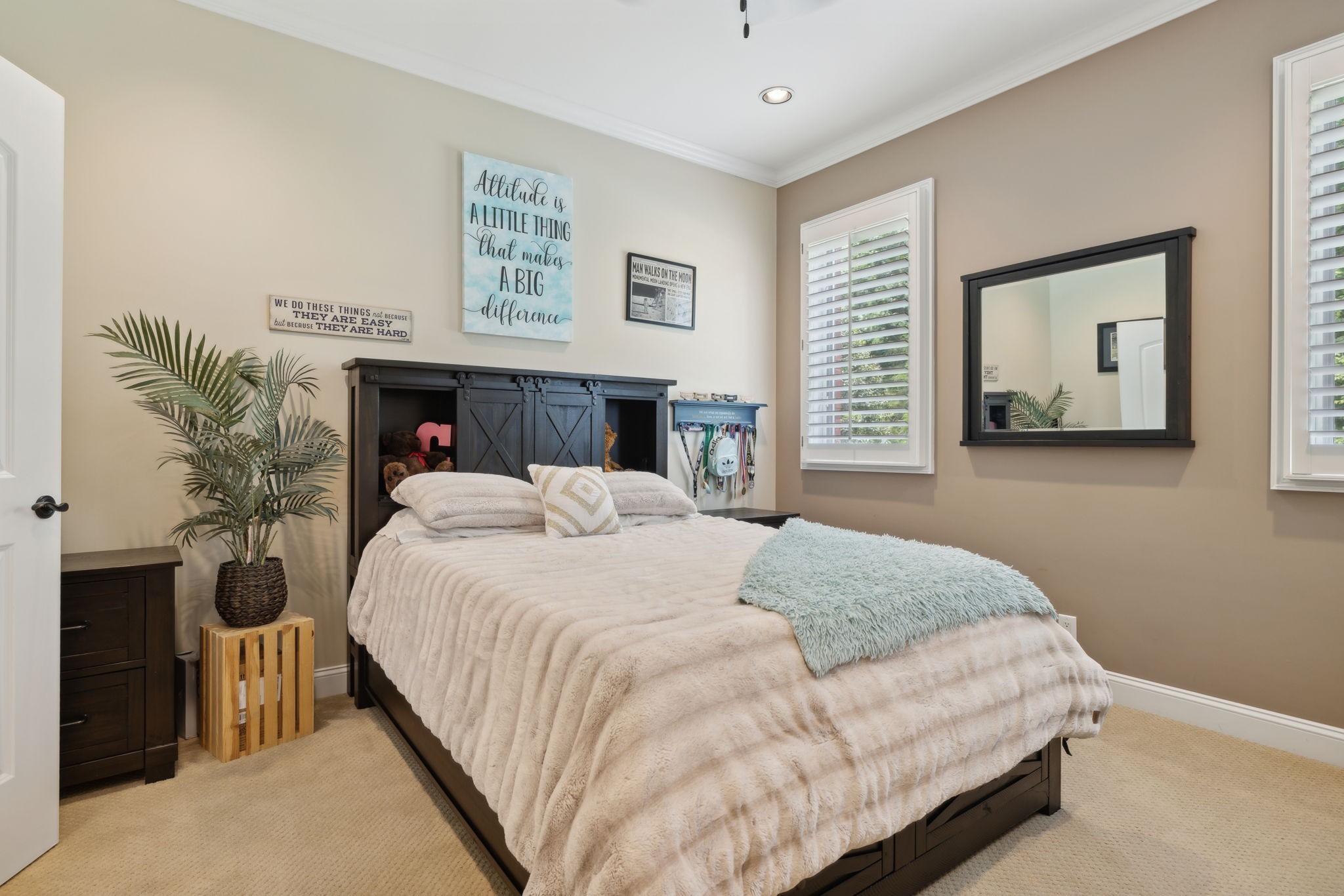 2526 Bearden Road Clarksville, TN 37043 - Photo 27 of 69 a bedroom with a large bed and a chandelier
