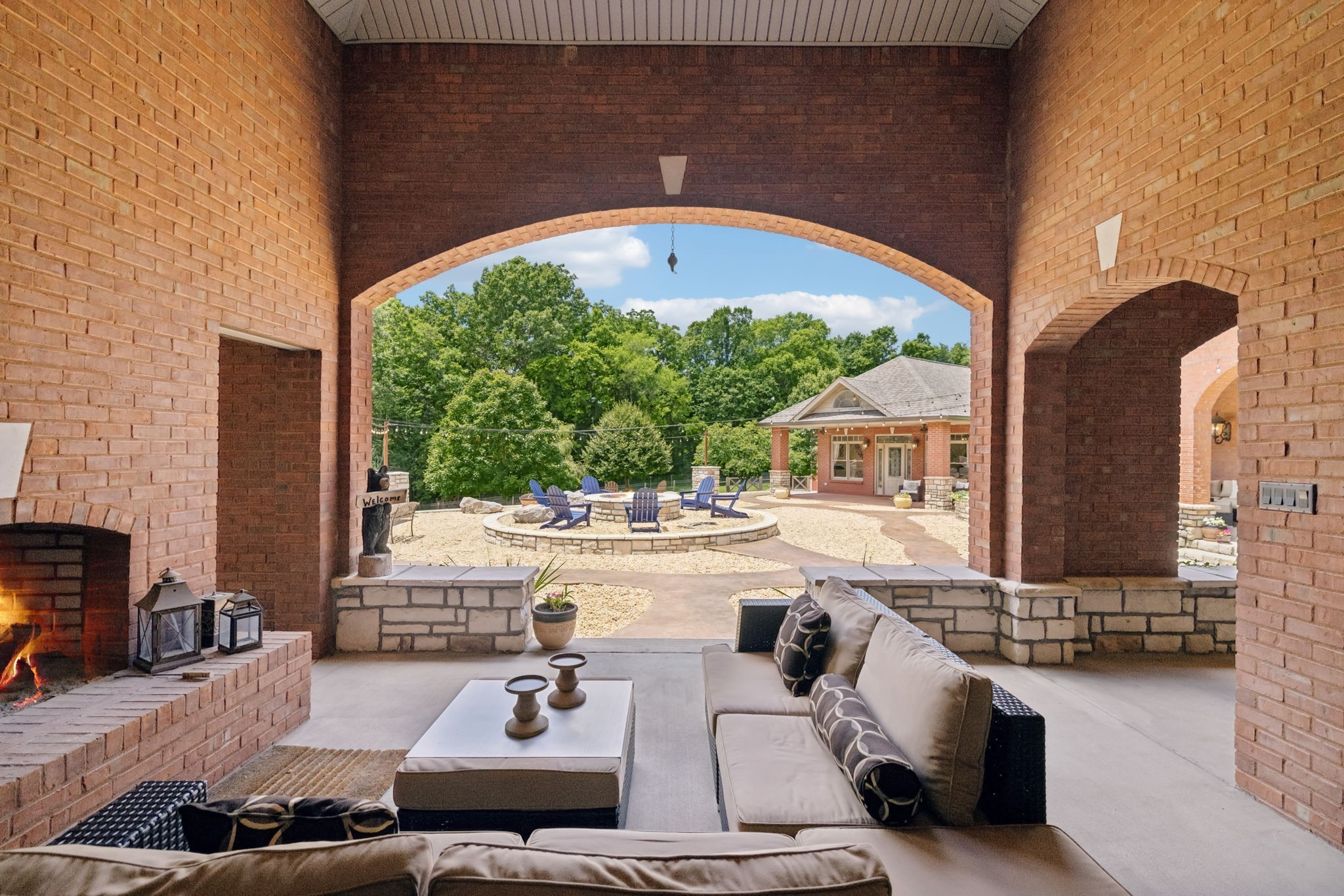 2526 Bearden Road Clarksville, TN 37043 - Photo 42 of 69 a view of a patio with couches table and chairs under an umbrella