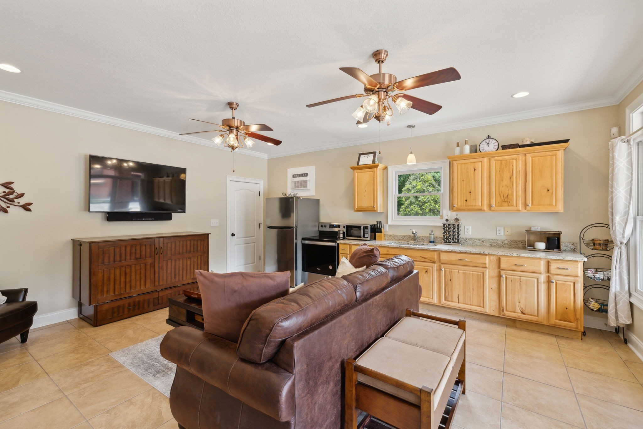 2526 Bearden Road Clarksville, TN 37043 - Photo 51 of 69 a living room with furniture a fireplace and a flat screen tv