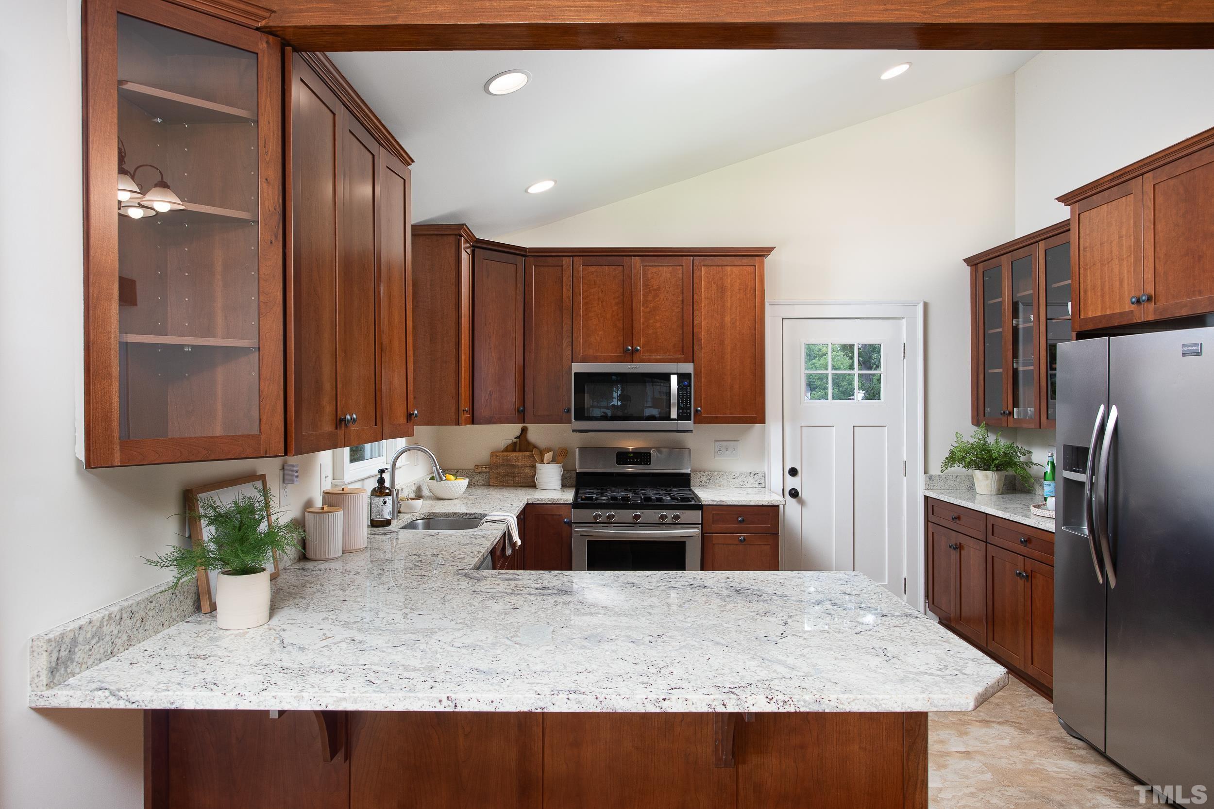 1218 North Roxboro Street Durham, NC 27701 - Photo 12 of 39 a kitchen with stainless steel appliances granite countertop a stove top oven a refrigerator a sink and dishwasher