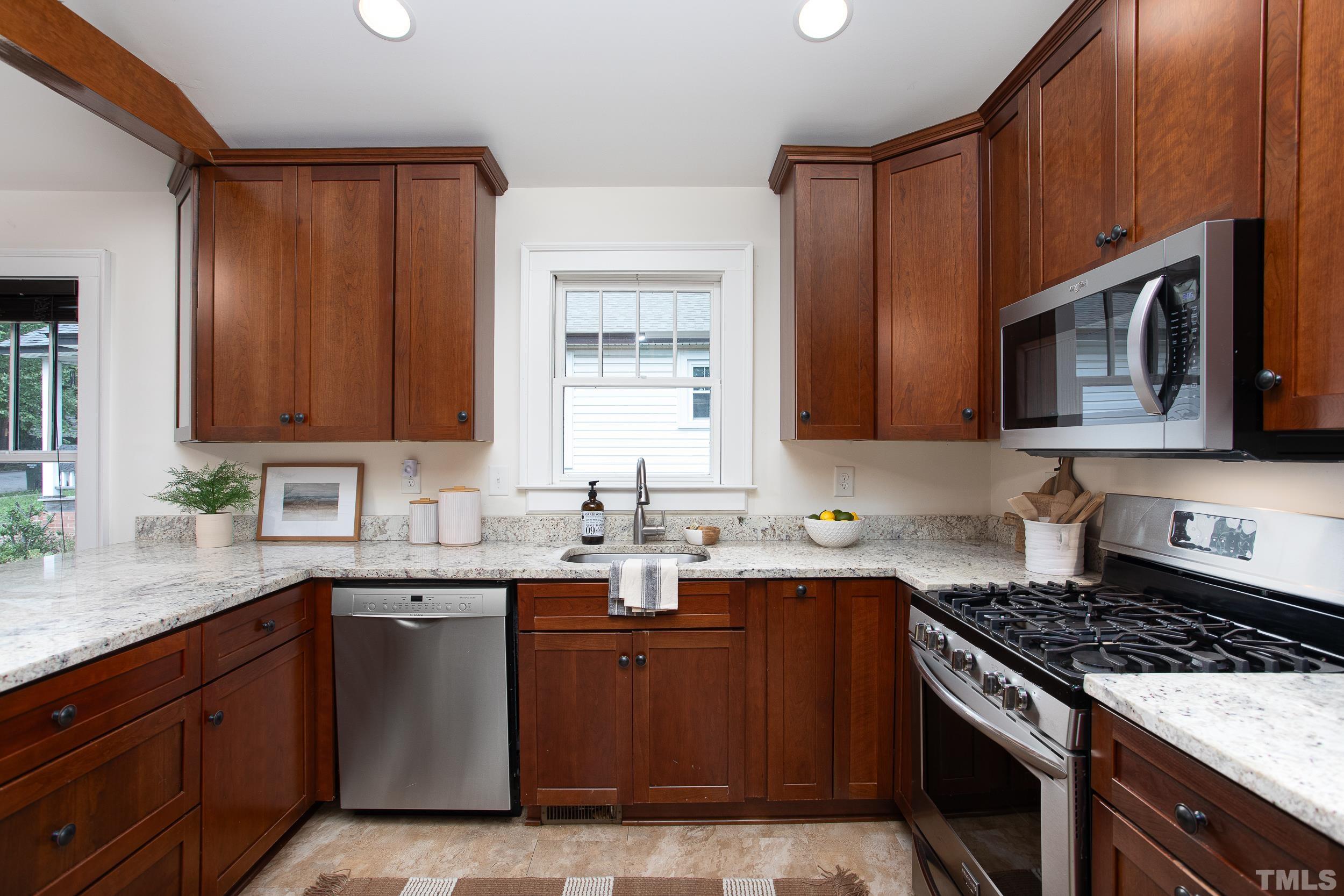 1218 North Roxboro Street Durham, NC 27701 - Photo 14 of 39 a kitchen with a sink stove top oven and cabinets