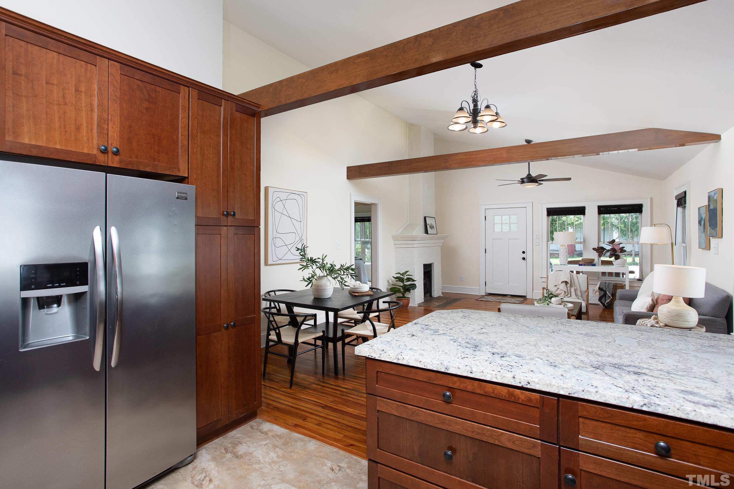 1218 North Roxboro Street Durham, NC 27701 - Photo 16 of 39 a kitchen with stainless steel appliances kitchen island granite countertop a refrigerator a sink and a stove
