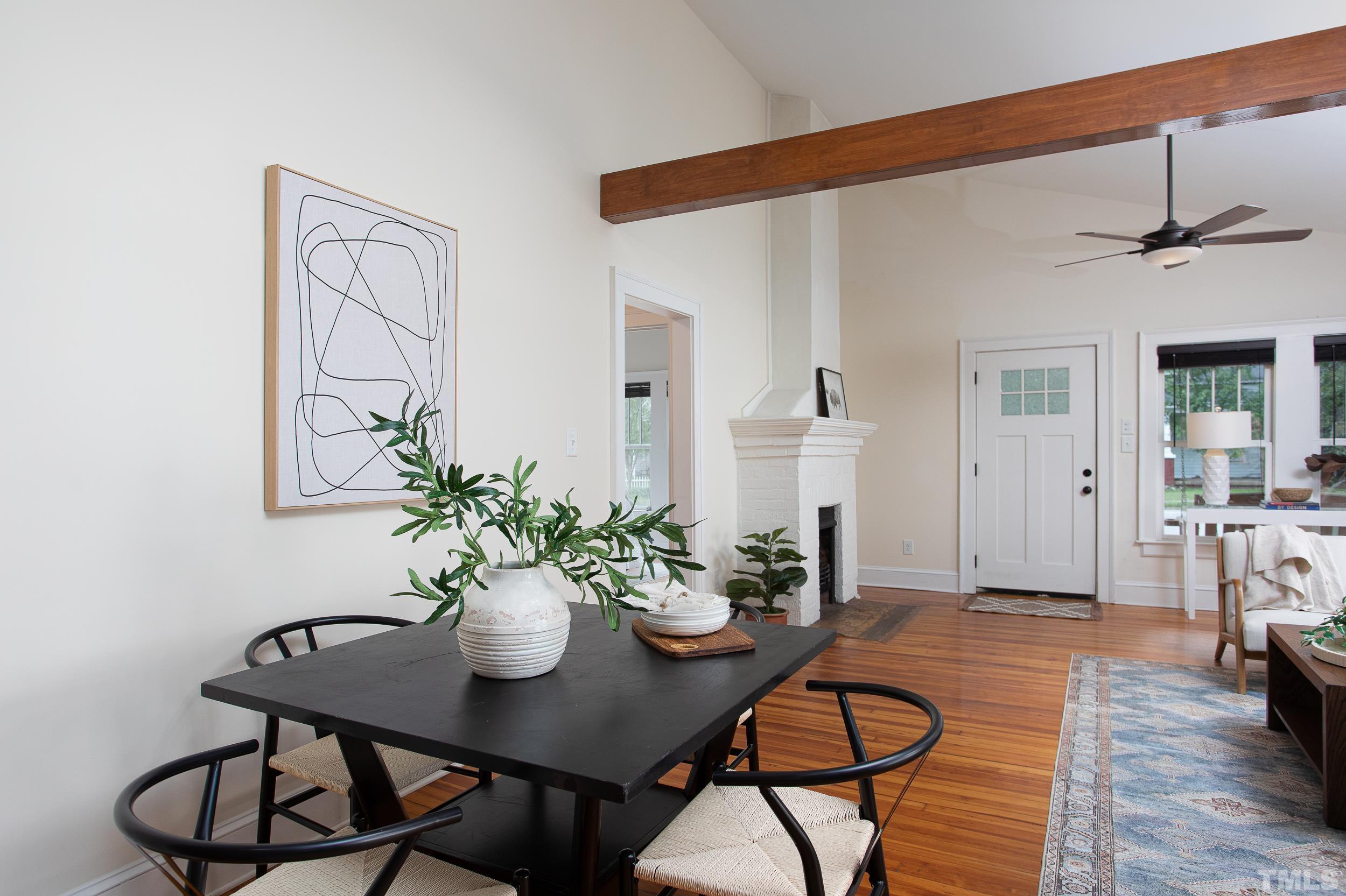 1218 North Roxboro Street Durham, NC 27701 - Photo 19 of 39 a view of a dining room with furniture and wooden floor