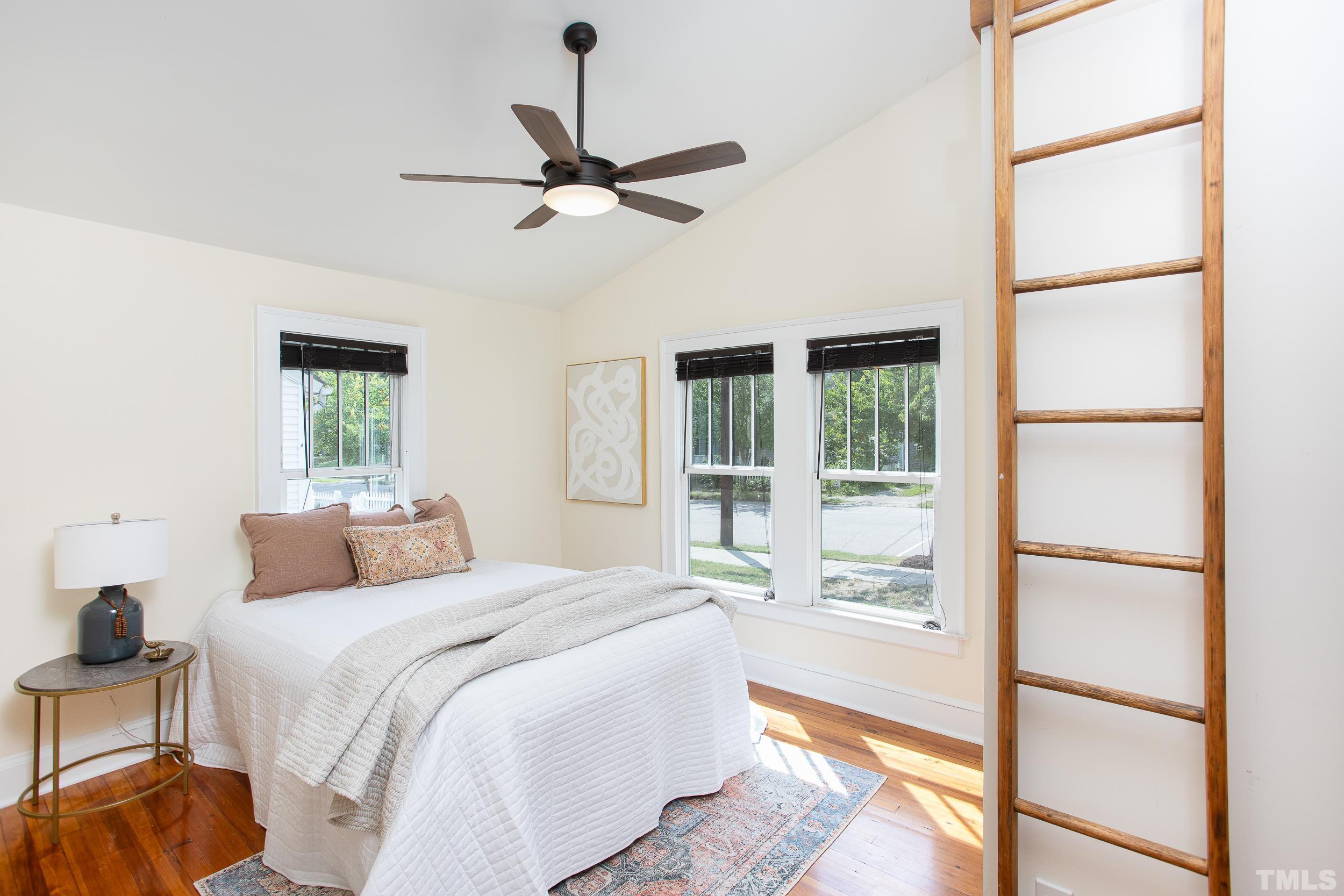 1218 North Roxboro Street Durham, NC 27701 - Photo 20 of 39 a bedroom with a large bed and a window