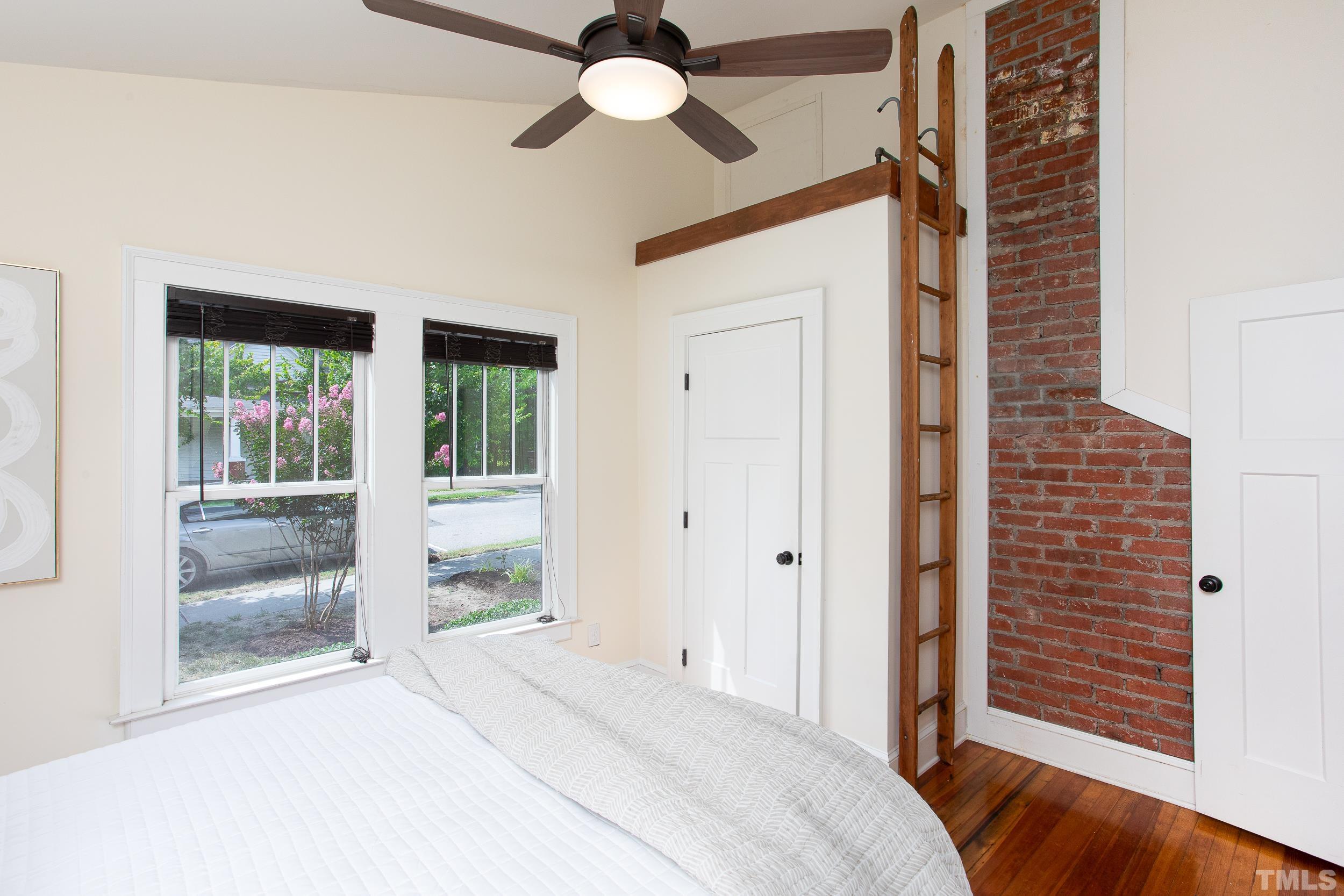 1218 North Roxboro Street Durham, NC 27701 - Photo 22 of 39 a bedroom with a bed and a window