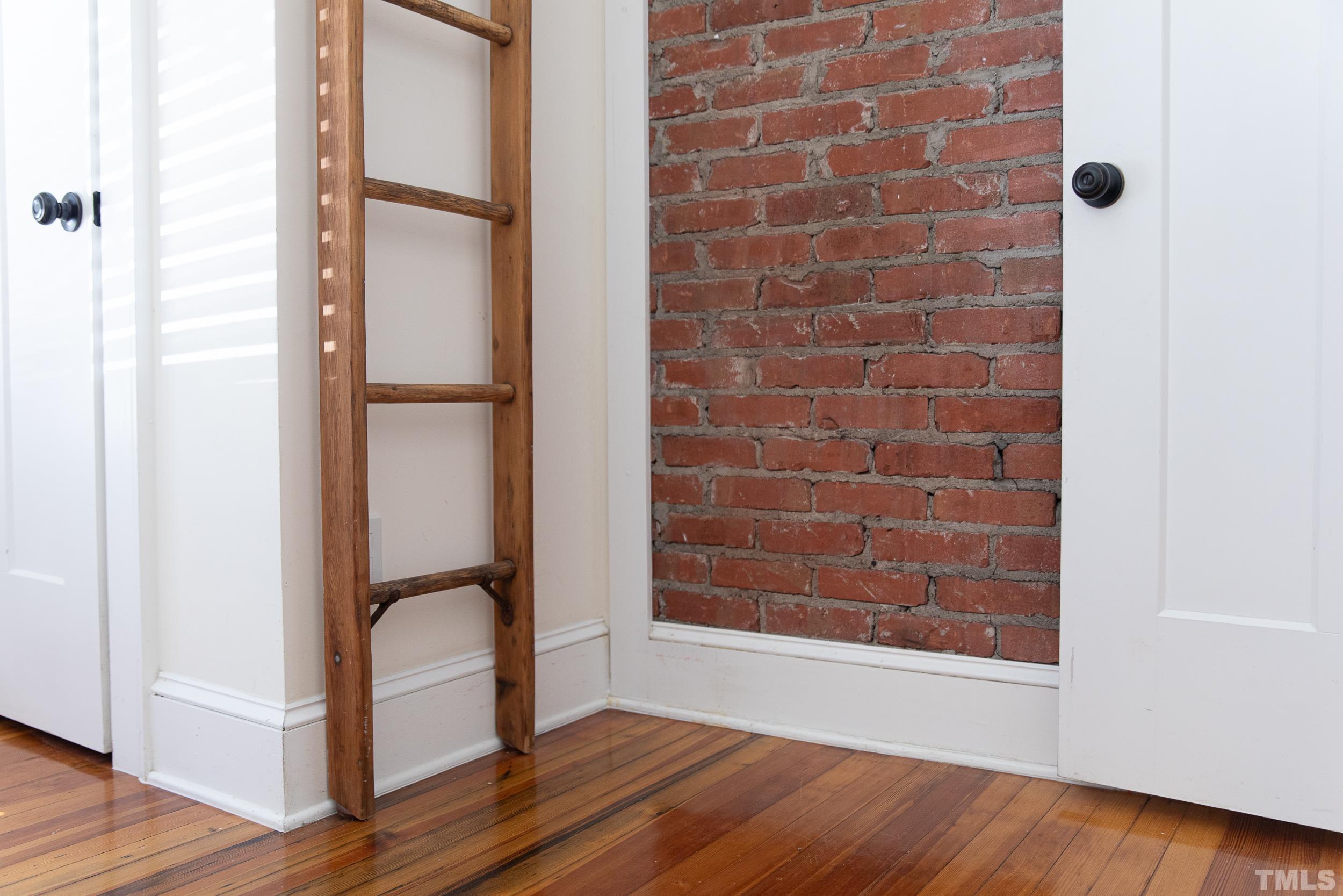 1218 North Roxboro Street Durham, NC 27701 - Photo 23 of 39 a view of an empty room with wooden floor and a window