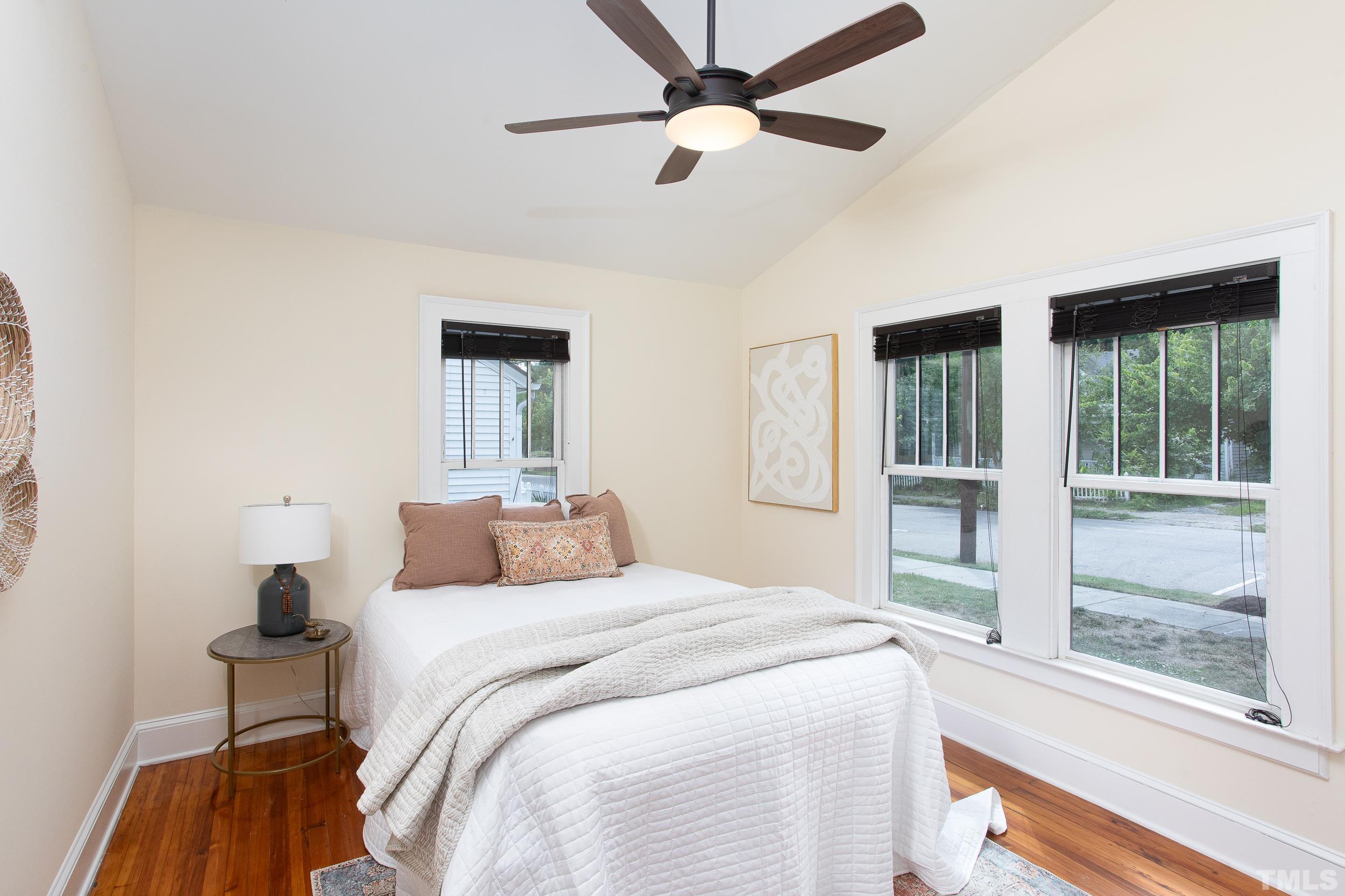 1218 North Roxboro Street Durham, NC 27701 - Photo 24 of 39 a bedroom with a large bed and a large window