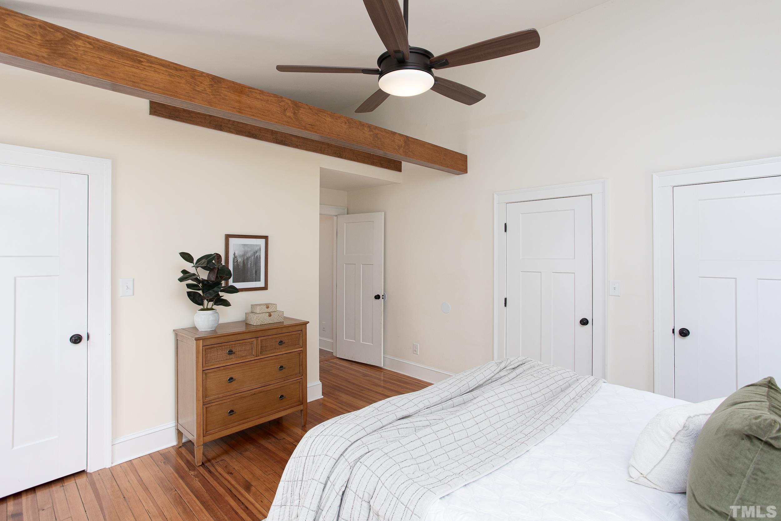 1218 North Roxboro Street Durham, NC 27701 - Photo 28 of 39 a bedroom with a bed and a tv on a dresser