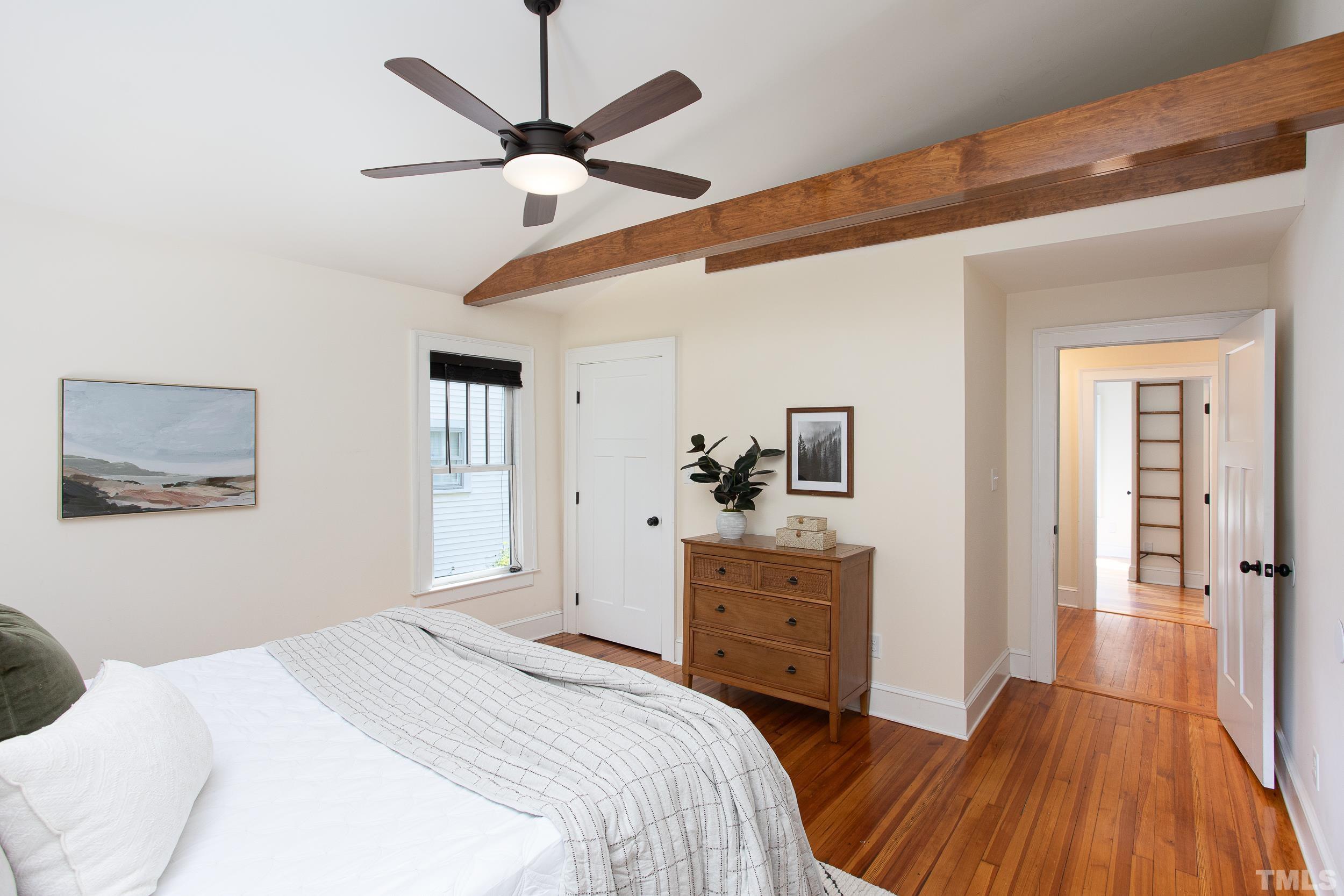 1218 North Roxboro Street Durham, NC 27701 - Photo 29 of 39 a bedroom with a bed and a dresser