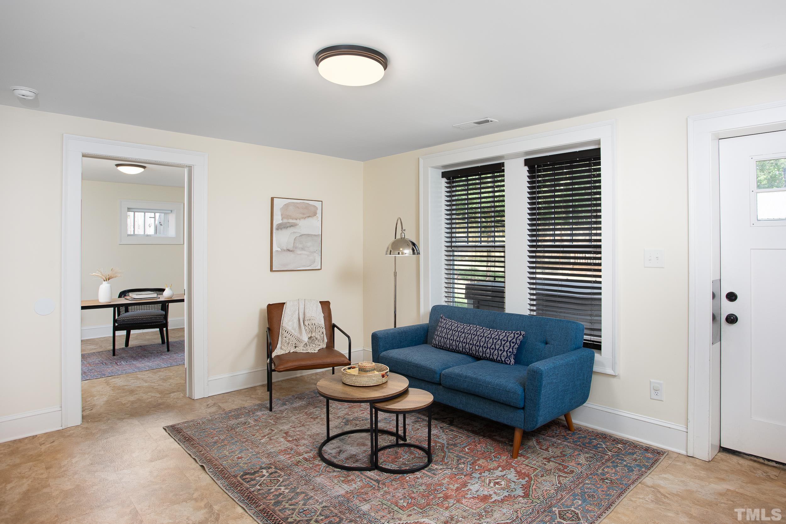 1218 North Roxboro Street Durham, NC 27701 - Photo 30 of 39 a living room with furniture and a window
