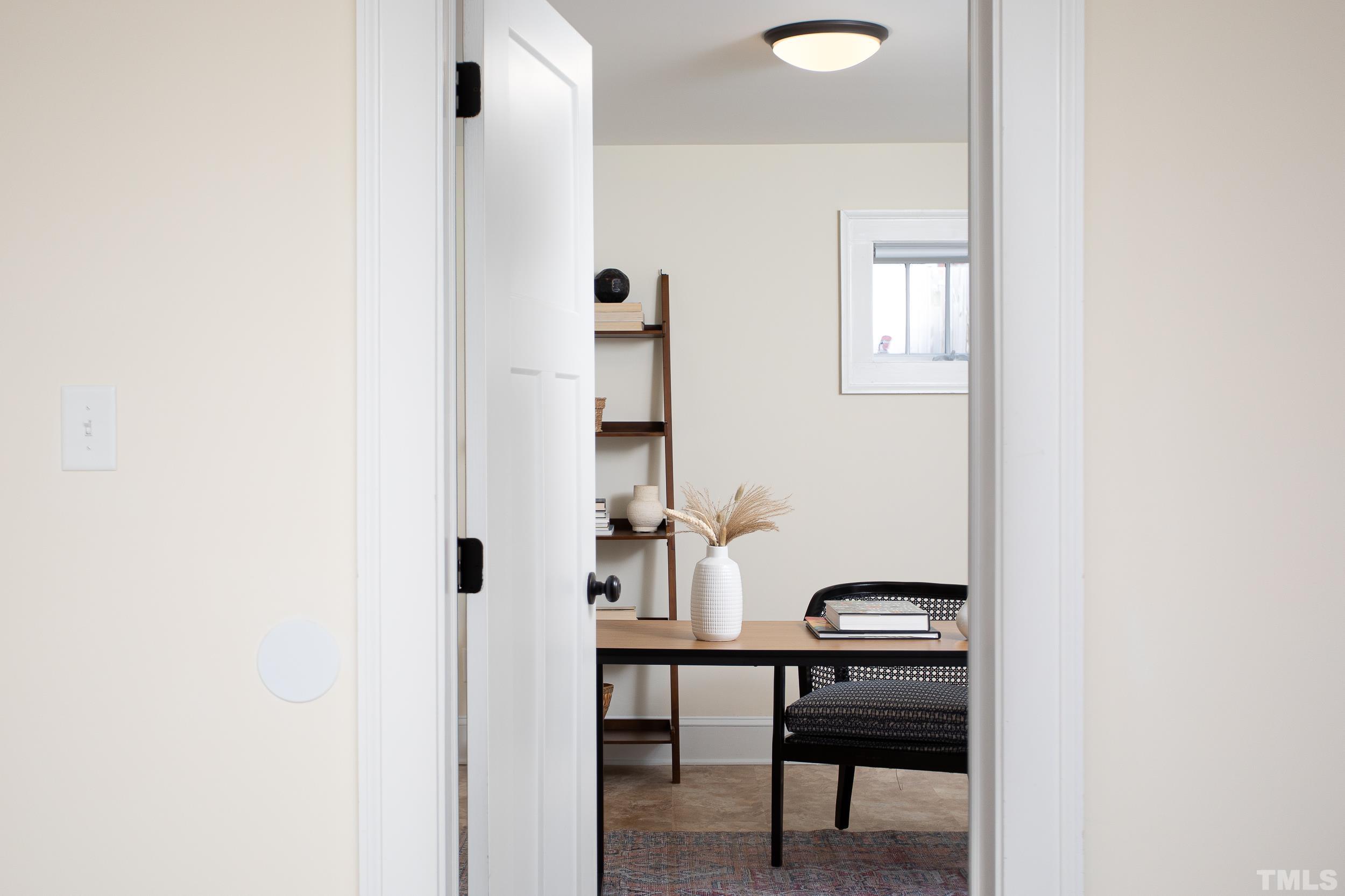 1218 North Roxboro Street Durham, NC 27701 - Photo 31 of 39 a view of a room with table and chair