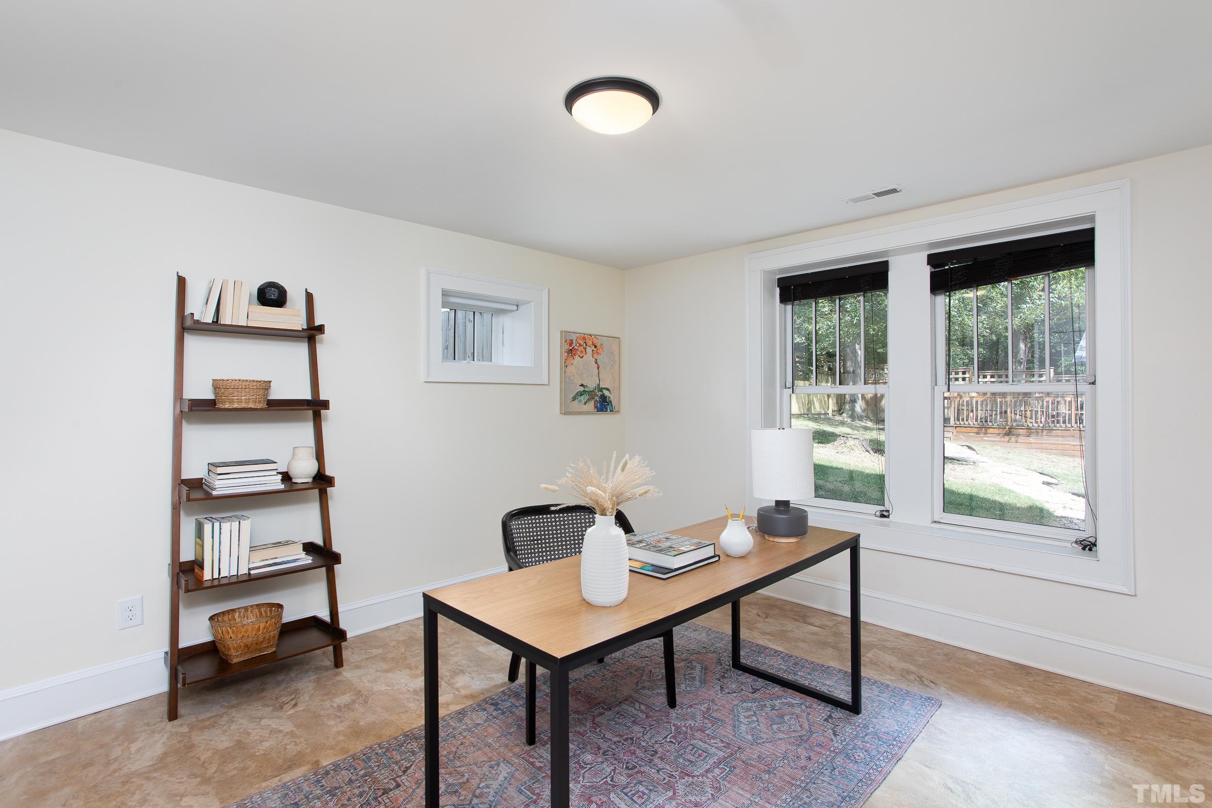 1218 North Roxboro Street Durham, NC 27701 - Photo 32 of 39 a view of a workspace with lounge chair and a window