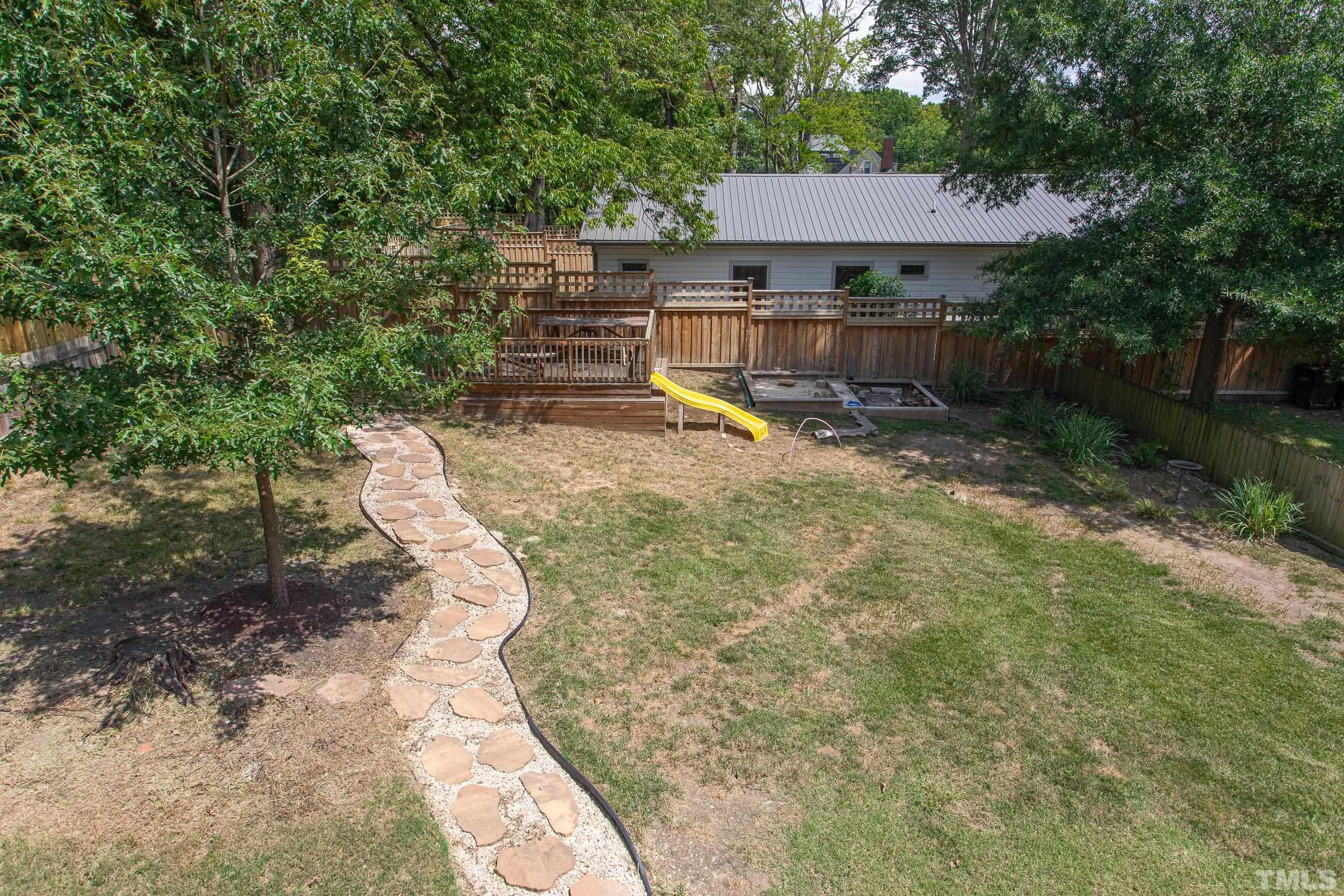 1218 North Roxboro Street Durham, NC 27701 - Photo 39 of 39 a view of a backyard with a small cabin