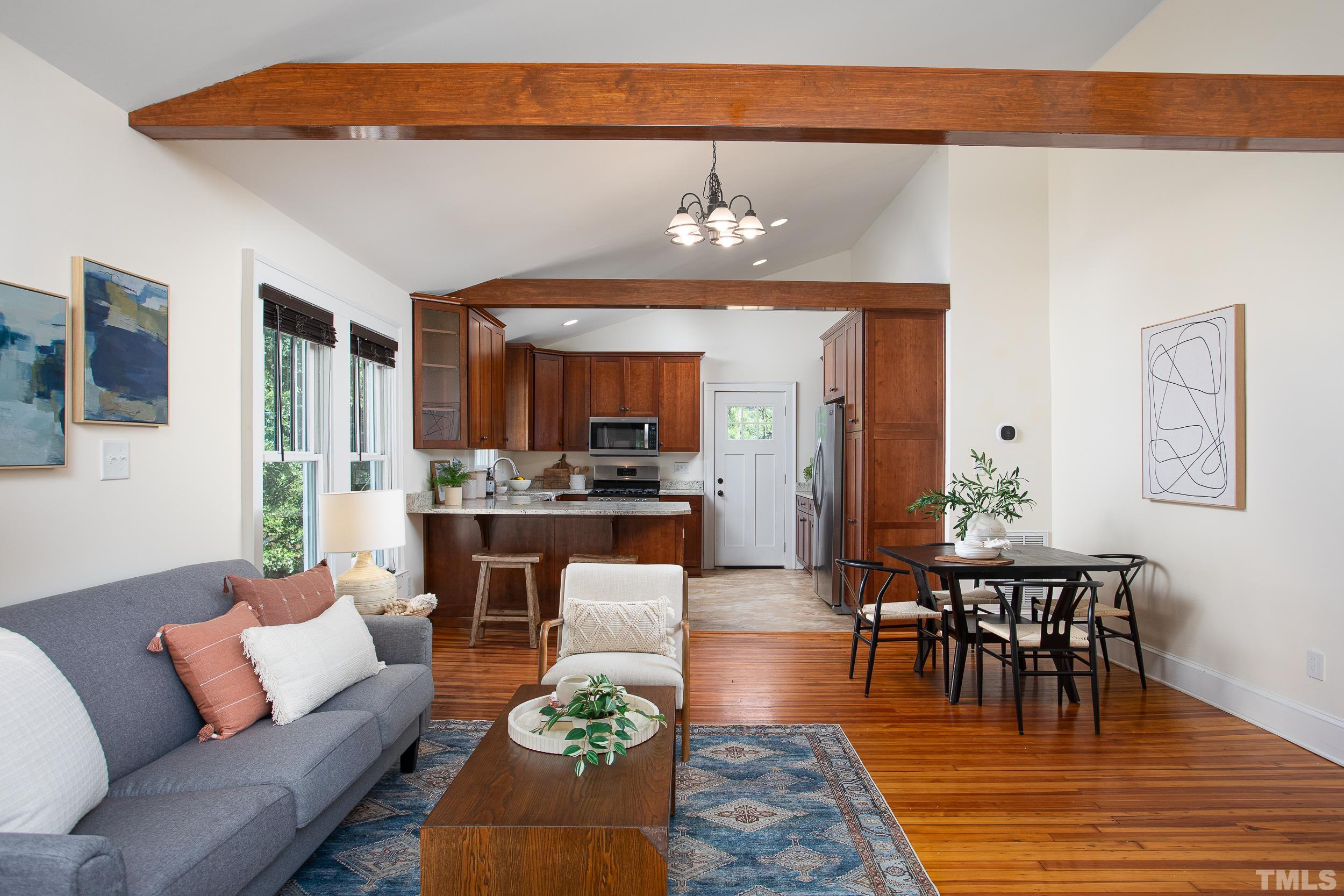 1218 North Roxboro Street Durham, NC 27701 - Photo 4 of 39 a living room with furniture a rug and kitchen view