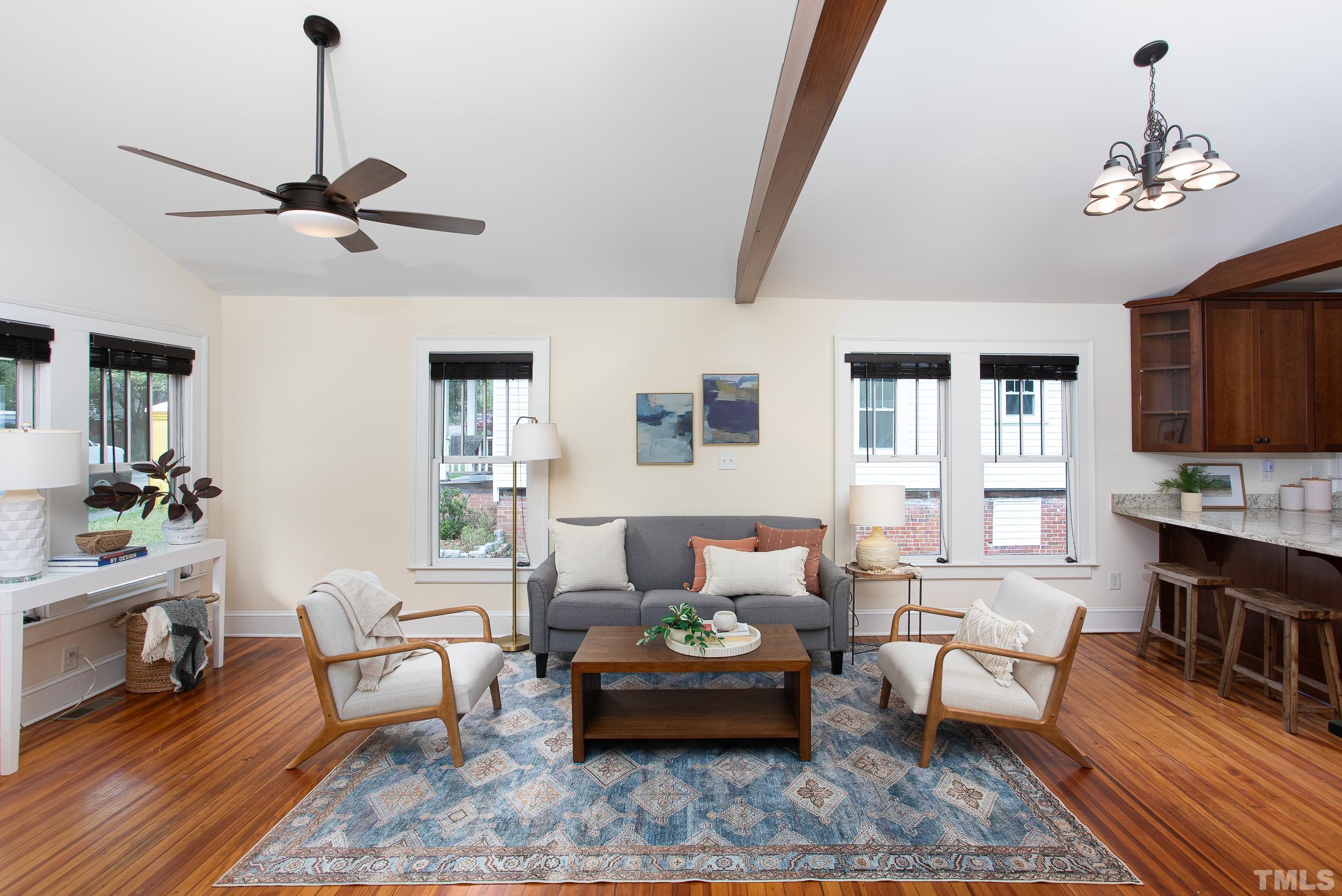 1218 North Roxboro Street Durham, NC 27701 - Photo 8 of 39 a living room with furniture fireplace and a flat screen tv