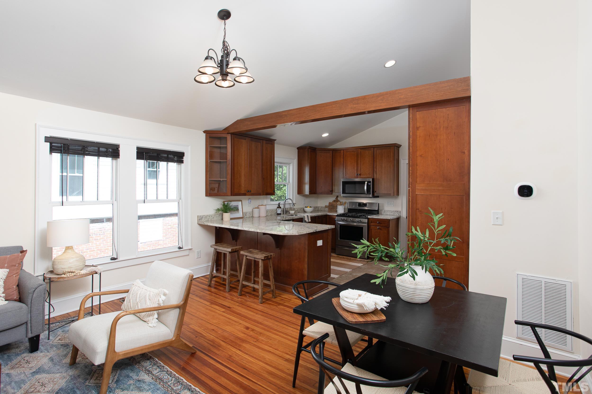 1218 North Roxboro Street Durham, NC 27701 - Photo 9 of 39 a view of a dining room with furniture