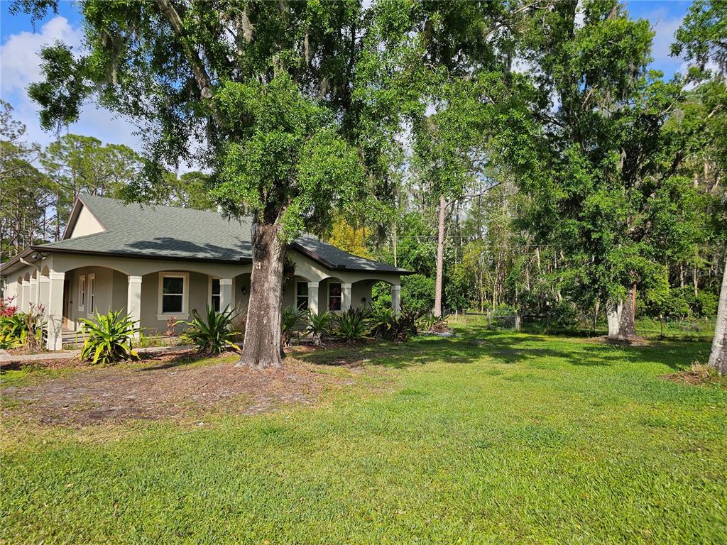 3465 Keystone Road Tarpon Springs, FL 34688 - Photo 1 of 1 a front view of a house with a yard