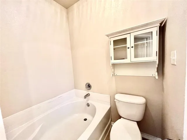 a bathroom with a toilet and sink