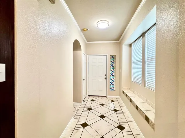 a view of an entryway with wooden floor
