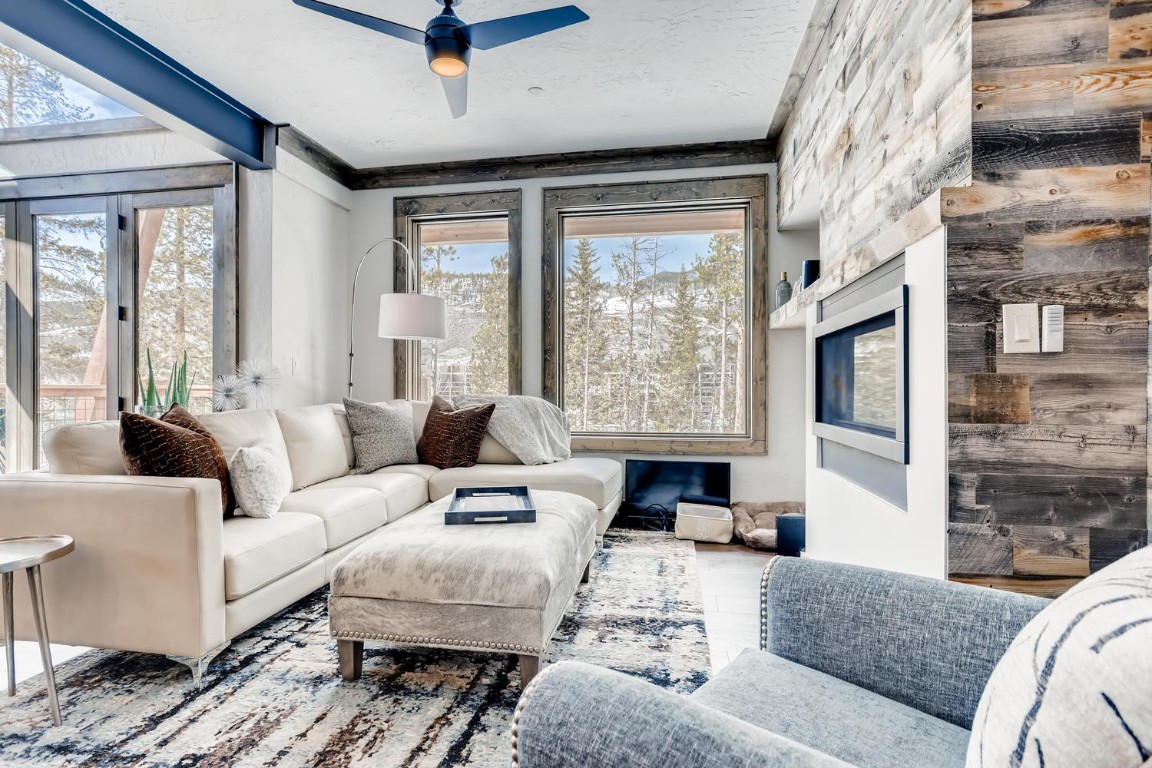 117 Lake Ridge Circle, Unit 1863 Keystone, CO 80435 - Photo 16 of 38 a living room with furniture large window and a fireplace