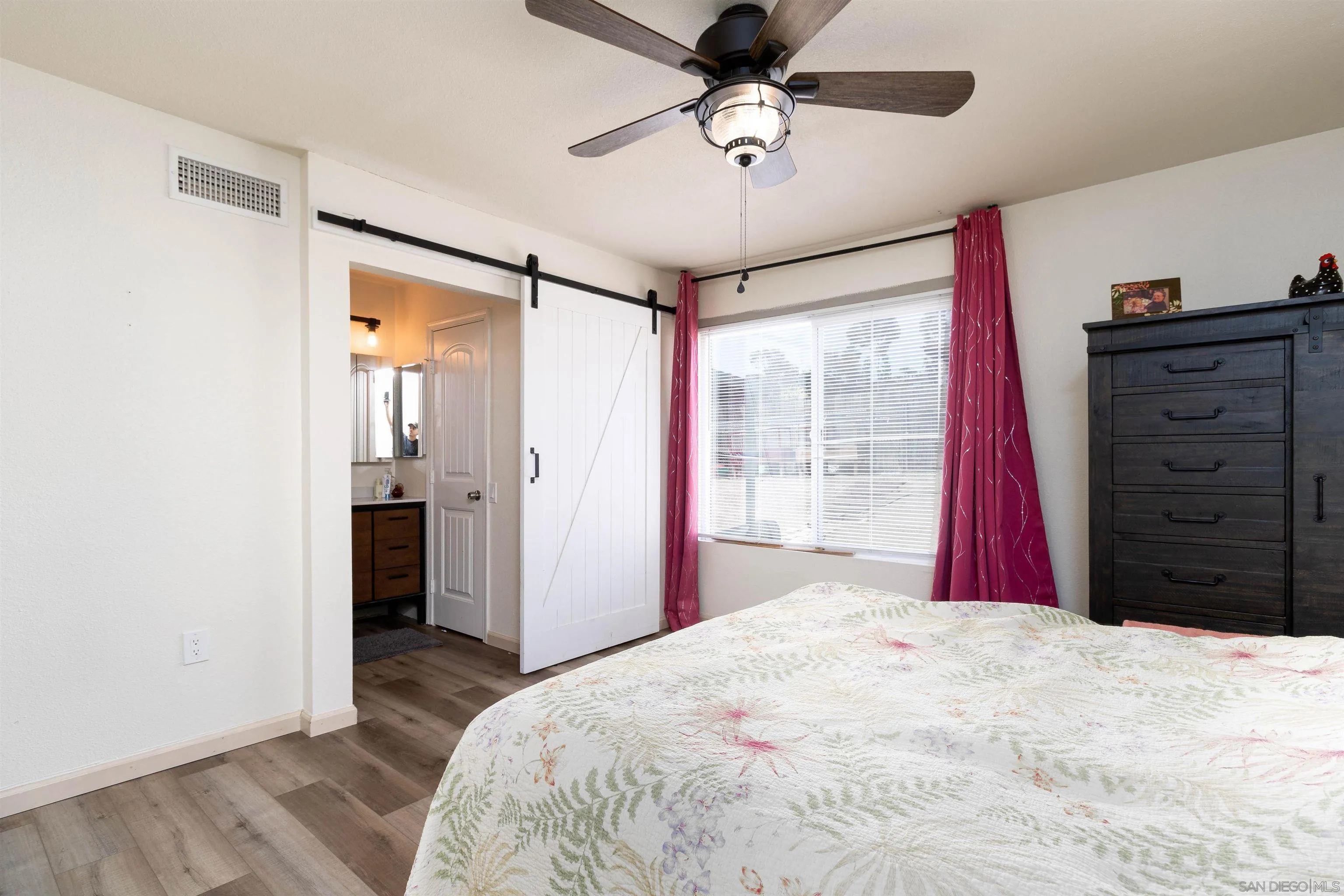 2532 Sweetwater Road Spring Valley, CA 91977 - Photo 5 of 21 a bedroom with a large bed and a large window