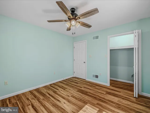 a bathroom with a sink toilet vanity and tub