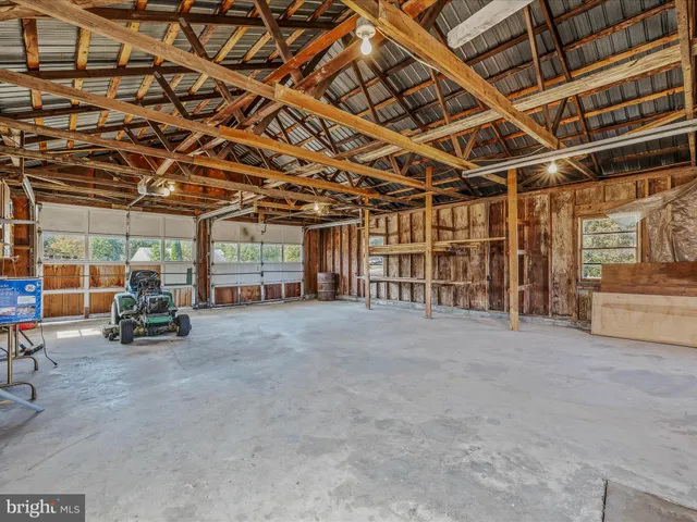 an aerial view of a house with a yard lake view and mountain view