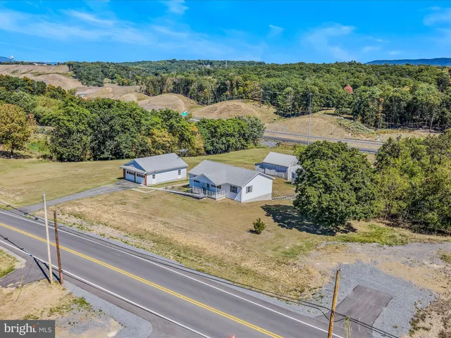 a view of a lake with couches and city view