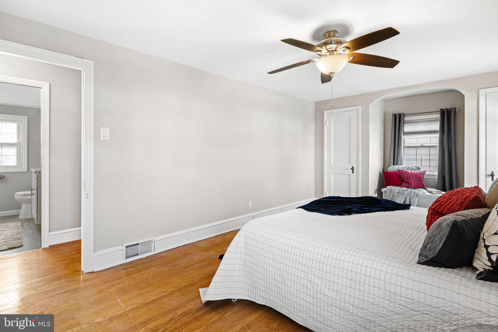 426 Avondale Avenue Haddonfield, NJ 08033 - Photo 25 of 40 a bedroom with a bed and a chandelier