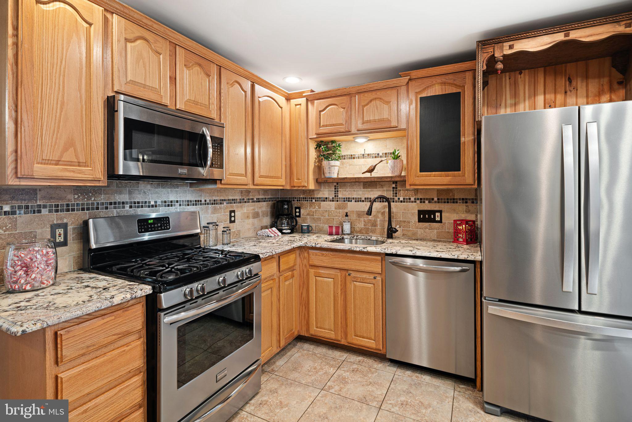 426 Avondale Avenue Haddonfield, NJ 08033 - Photo 10 of 40 a kitchen with stainless steel appliances granite countertop a refrigerator stove top oven and sink
