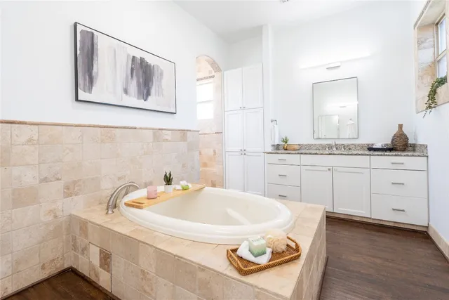 a bathroom with a tub and sink