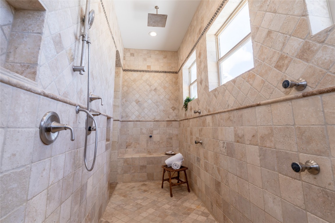 724 Chama Trace Dripping Springs, TX 78620 - Photo 17 of 40 a bathroom with a shower
