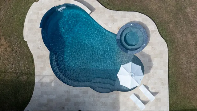 a living room with furniture kitchen view and a fireplace
