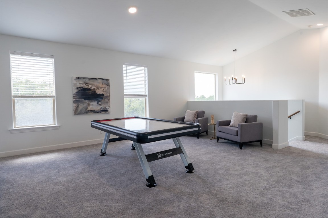 724 Chama Trace Dripping Springs, TX 78620 - Photo 24 of 40 a living room with furniture and a window