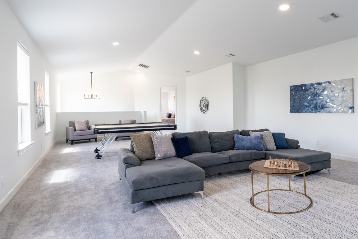 724 Chama Trace Dripping Springs, TX 78620 - Photo 25 of 40 a living room with furniture and a wooden floor