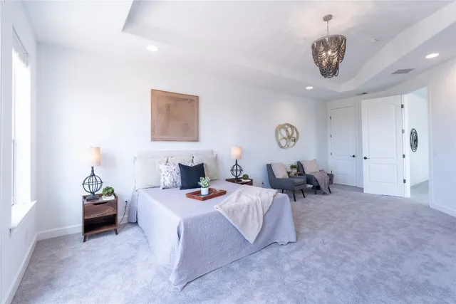 a bedroom with bed and a couch