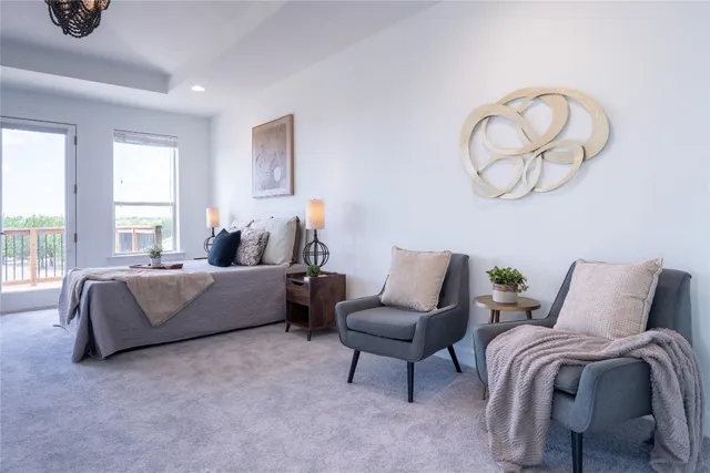 a spacious bathroom with a double vanity sink a mirror and a bathtub