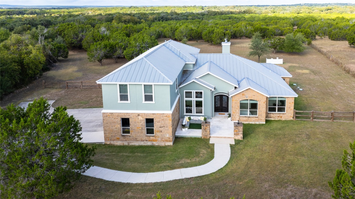 724 Chama Trace Dripping Springs, TX 78620 - Photo 36 of 40 a aerial view of a house with a yard