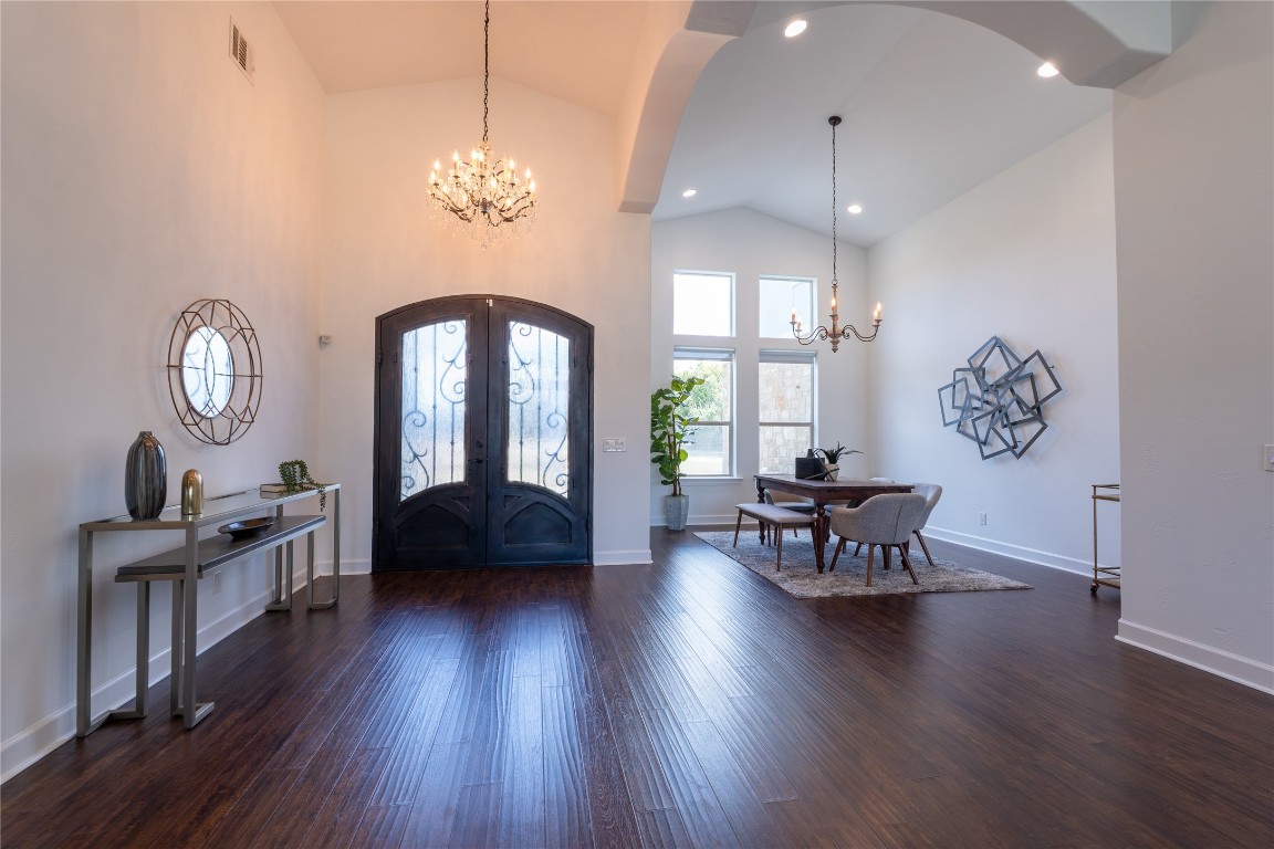 724 Chama Trace Dripping Springs, TX 78620 - Photo 4 of 40 a view of a livingroom with furniture window and wooden floor