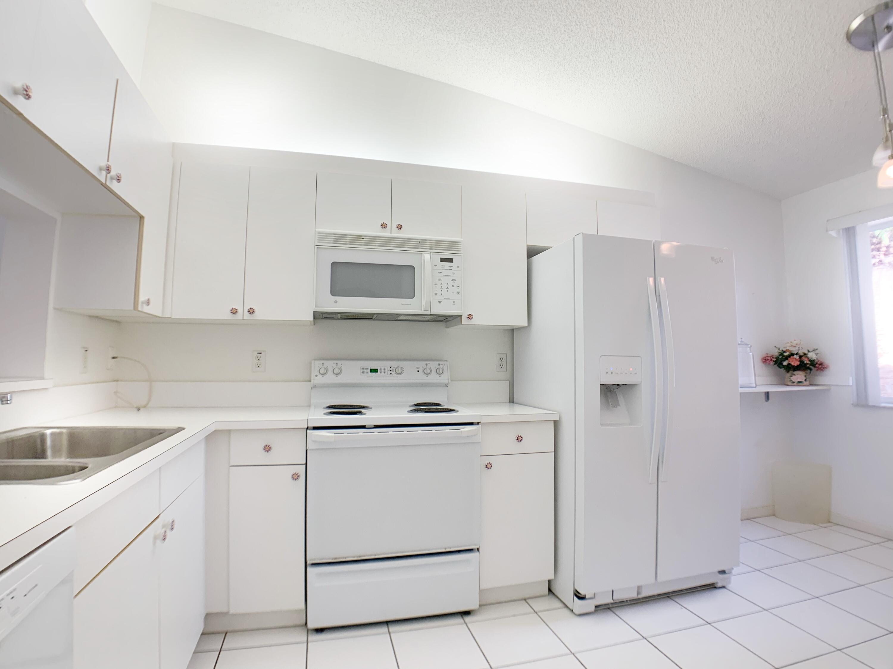 340 Northwest 67th Street, Unit 203 Boca Raton, FL 33487 - Photo 3 of 37 163A4074-73A9-45C0-BB9F-D114CC105BD8
