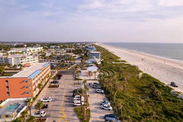 an aerial view of residential building and ocean