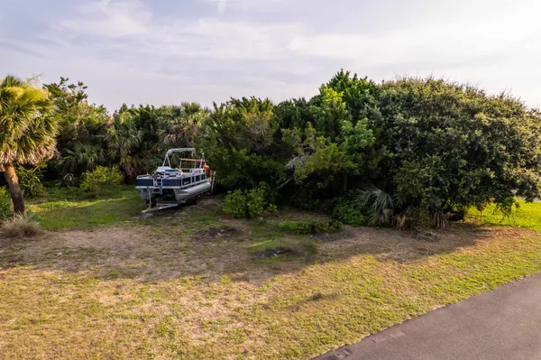 a view of a backyard with swimming pool