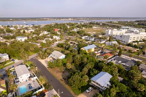 an aerial view of residential building with outdoor space and lake view