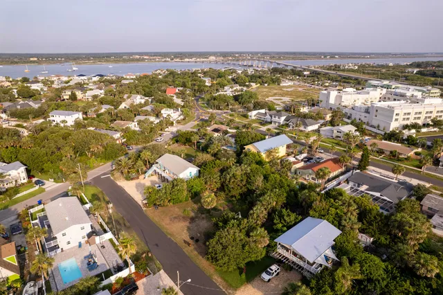 an aerial view of residential building with outdoor space and lake view
