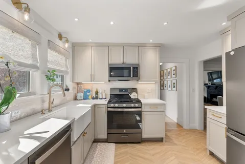 a kitchen with a stove and a refrigerator